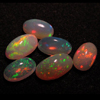 5 - 9 mm oval - Ethiopian Opal - really - tope grade high quality CABOCHON - oval shape - each pcs - have amazing - beautifull - flashy fire all around in the stone -6 pcs - approx -- STUNNING QUALITY - VERY VERY RARE